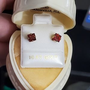 New 10k garnet stud earrings. Stamped 10k. Princess cut genuine garnets. Each on